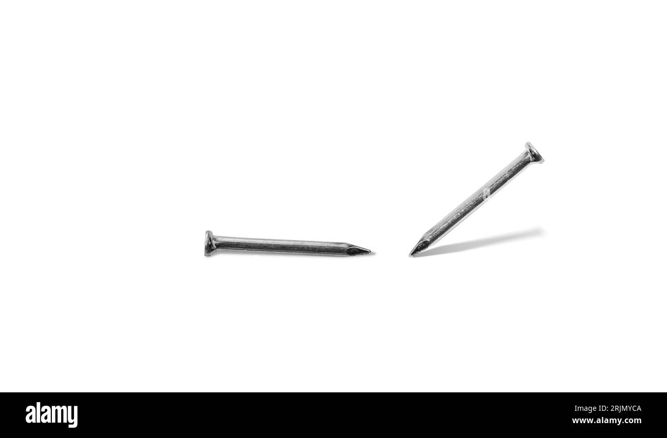 Steel nail. Two metallic nails close up with shadow on white background