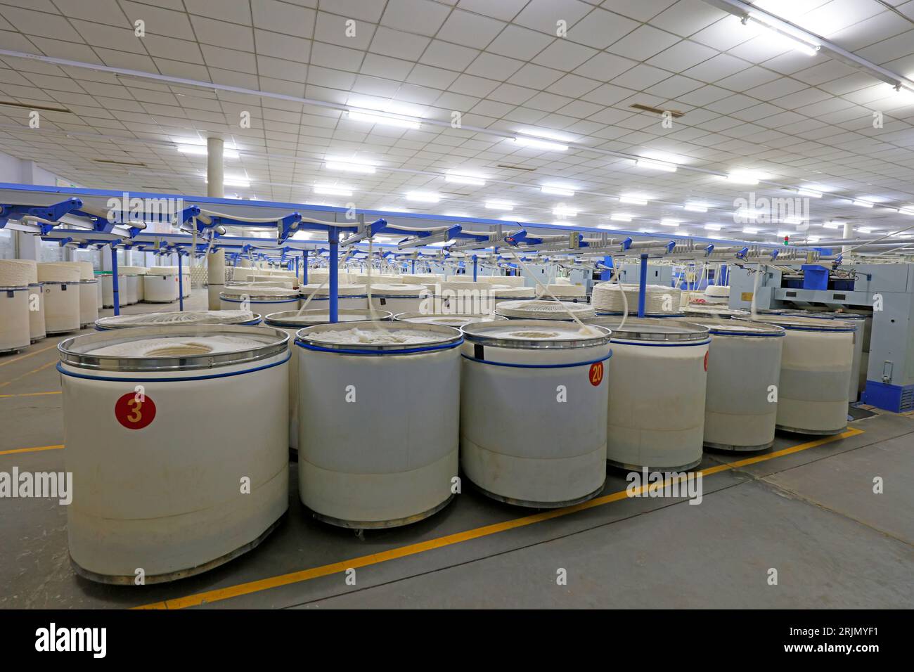 Cotton yarn on spinning line Stock Photo - Alamy