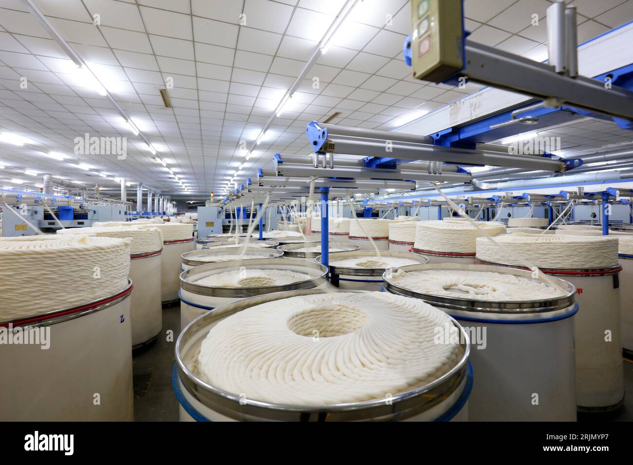 Cotton yarn on spinning line Stock Photo - Alamy