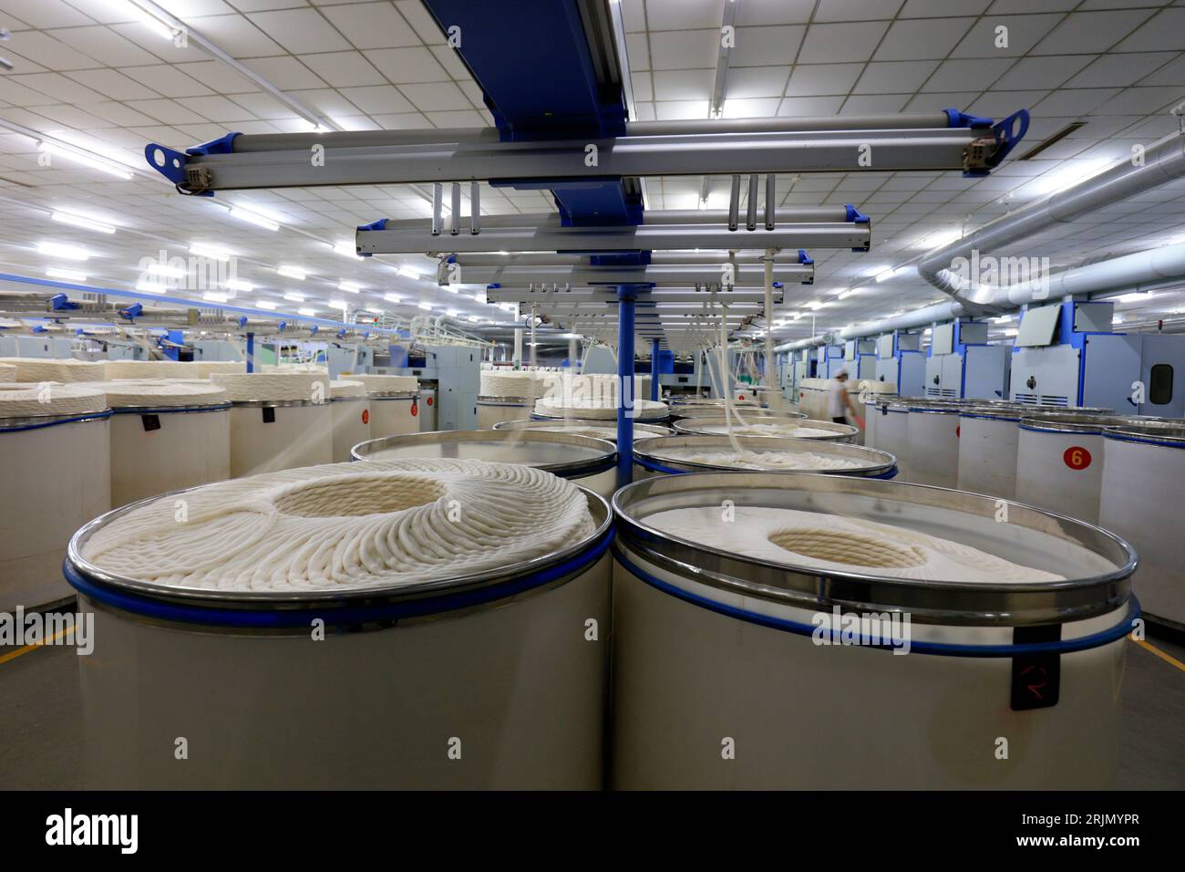 Cotton yarn on spinning line Stock Photo - Alamy