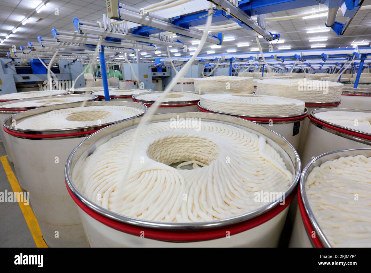 Cotton yarn on spinning line Stock Photo - Alamy