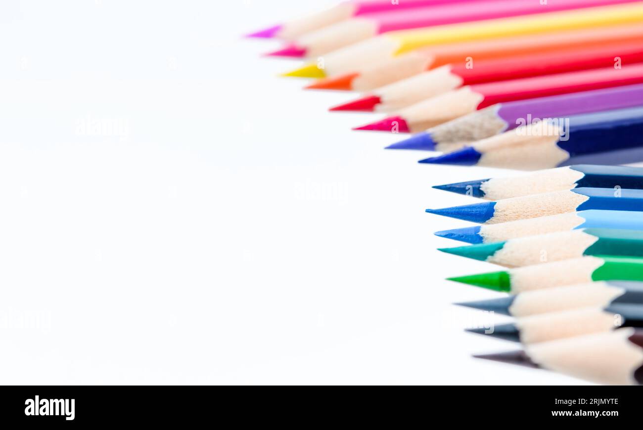 A row of wooden colored pencils isolated on white background Stock ...