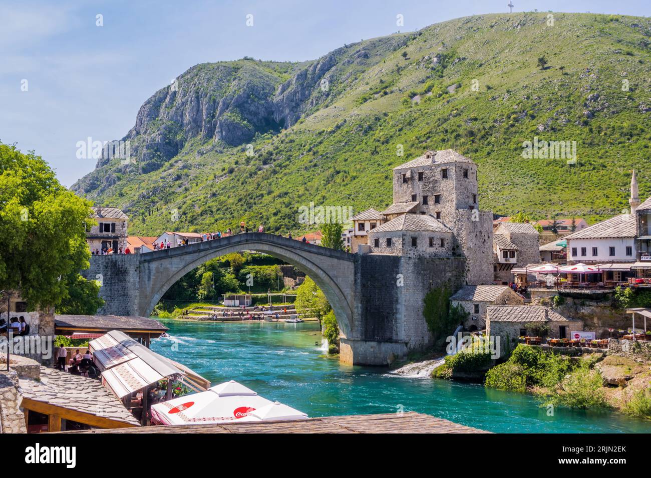 A scenic view of the historic bridge crossing over the picturesque river in the charming old town of Most Stock Photo