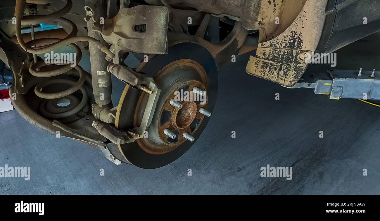 Car disc brake system. Car suspension in process of new tire