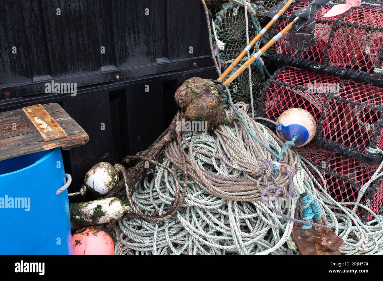 Tools of the lobster fishing trade with lobster pots, floats, marker
