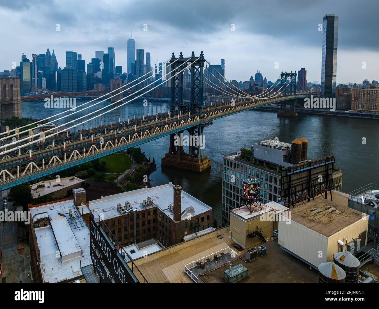 An aerial view of both the Manhattan and Brooklyn Bridges on a cloudy ...