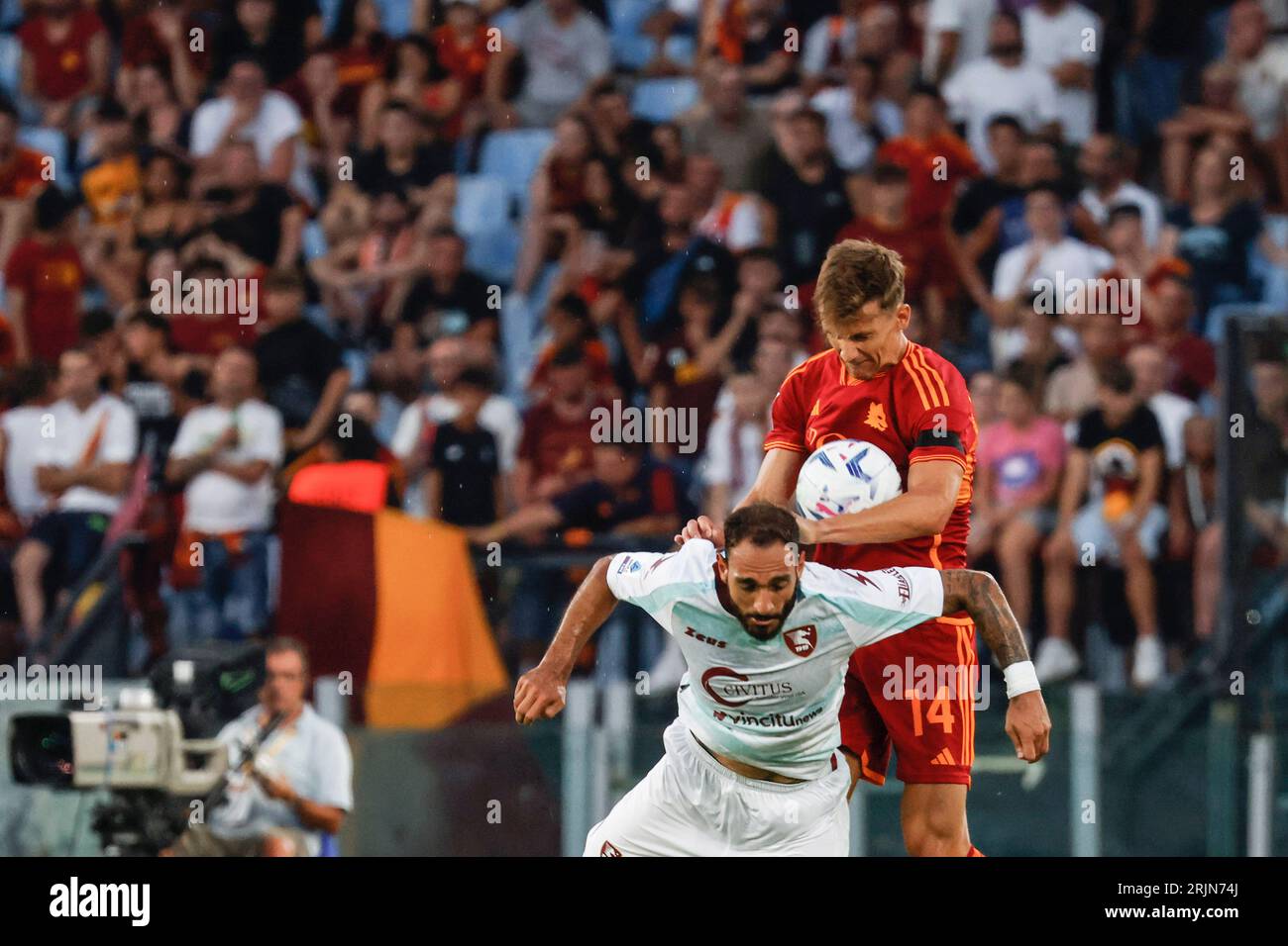 Rome, Italy, 20 August, 2023. Grigoris Kastanos, left, of Salernitana, and Diego Llorente, of AS Roma, fight for the ball during the Italian Serie A championship football match between Roma and Salernitana at the Olympic Stadium Stock Photo