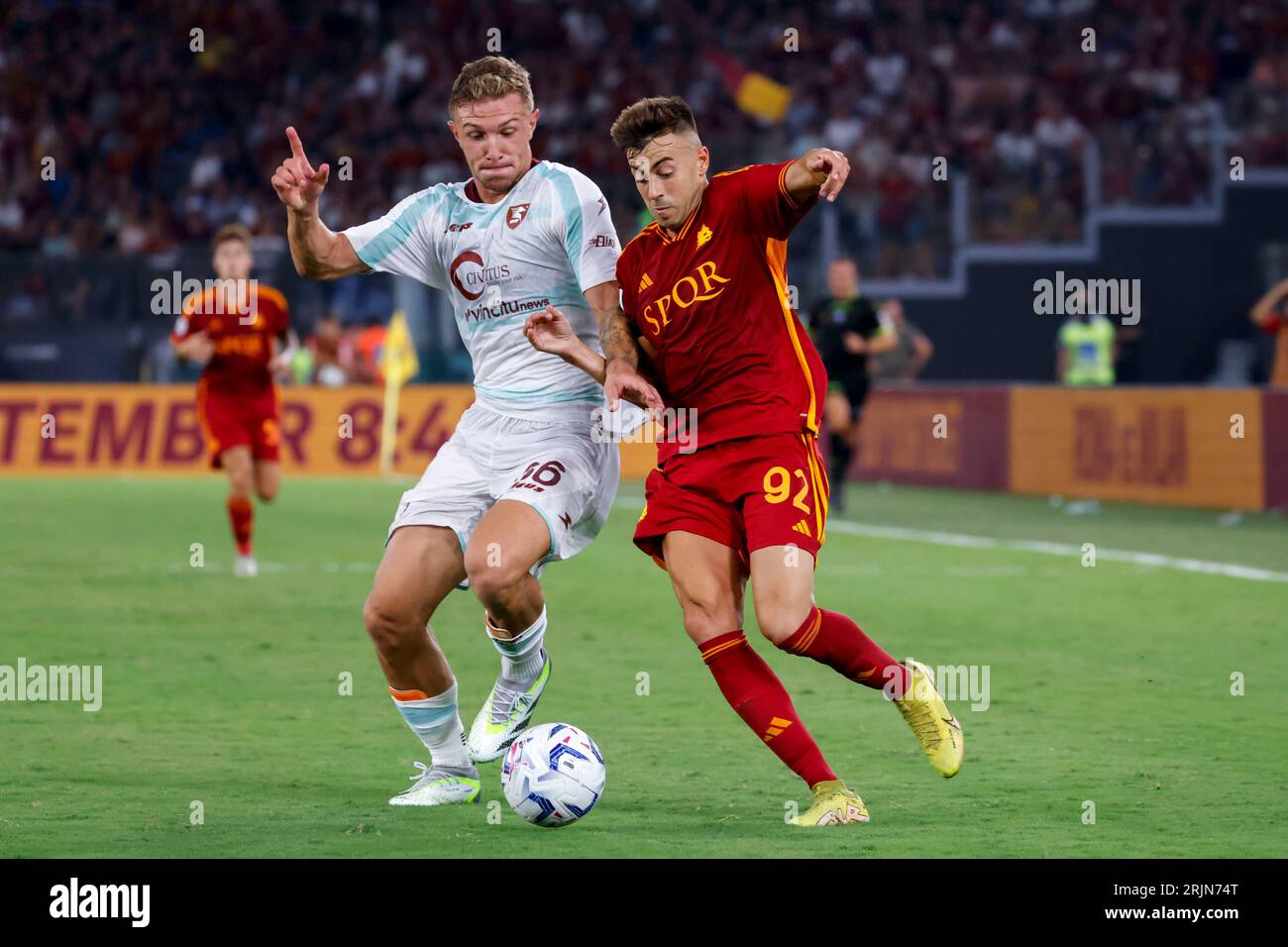 Rome, Italy, 20 August, 2023. Matteo Lovato, left, of Salernitana, and Stephan El Shaarawy, of AS Roma, fight for the ball during the Italian Serie A championship football match between Roma and Salernitana at the Olympic Stadium Stock Photo