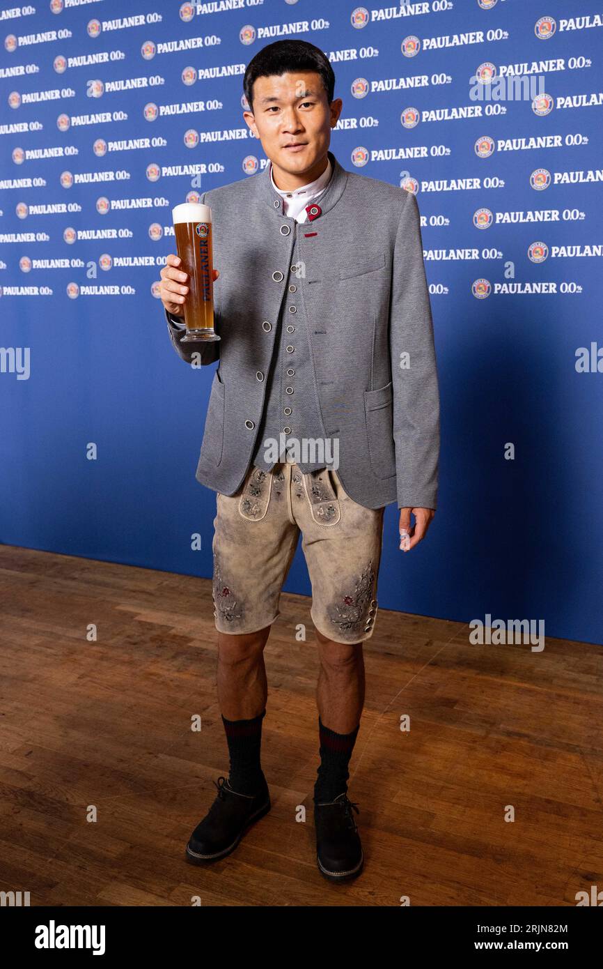 Munich, Germany. 22nd Aug, 2023. Min-Jae Kim toasts with a beer glass ...