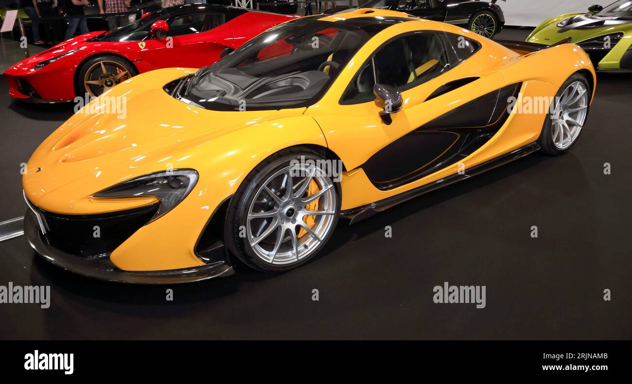 Three-quarters front view of a Yellow, McLaren P1,  on display on the Premier GT Stand, at the 2023 British Motor Show, Farnborough Stock Photo