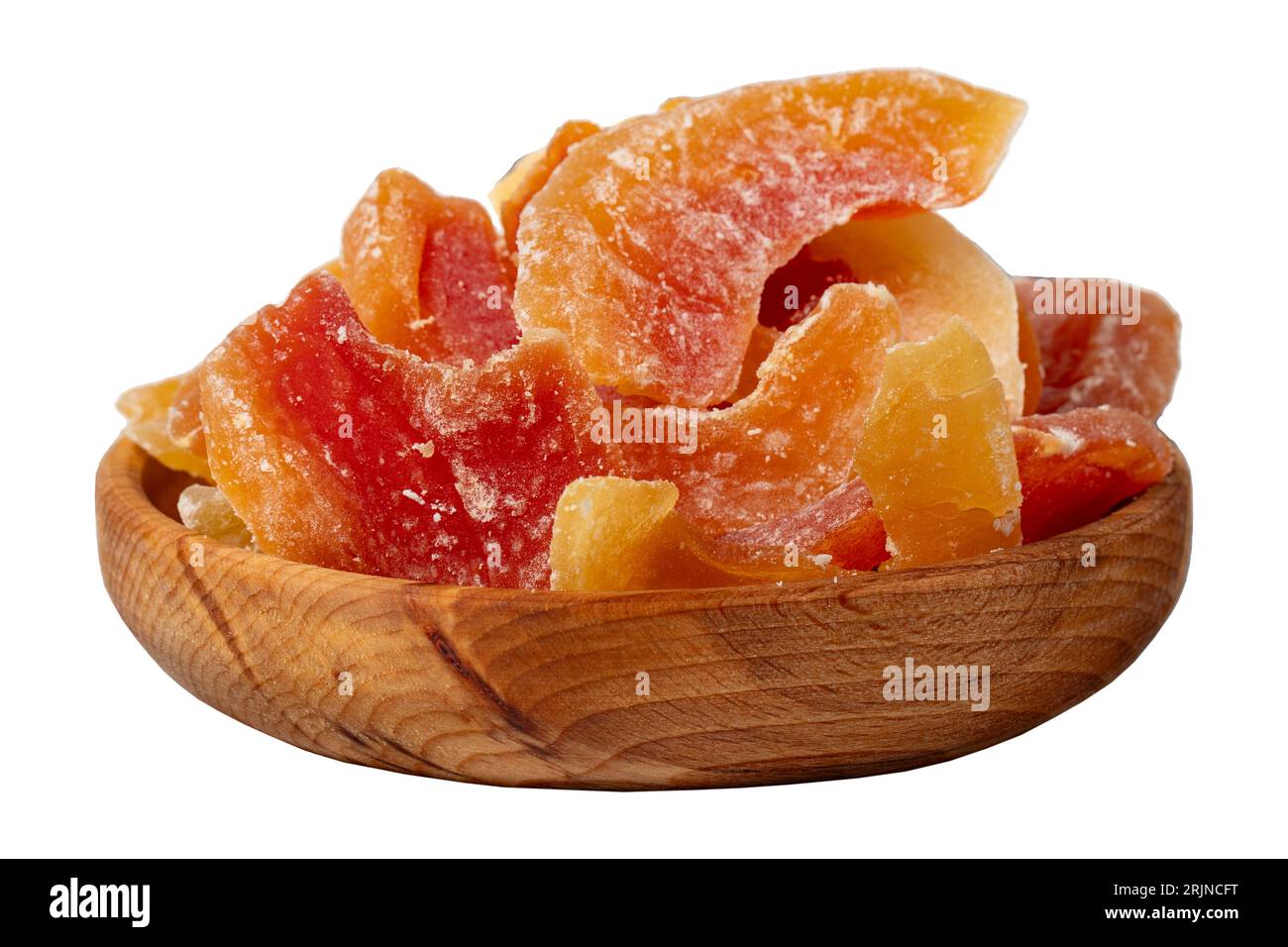 Dried papaya slices in wooden bowl. Sundried natural papaya slices