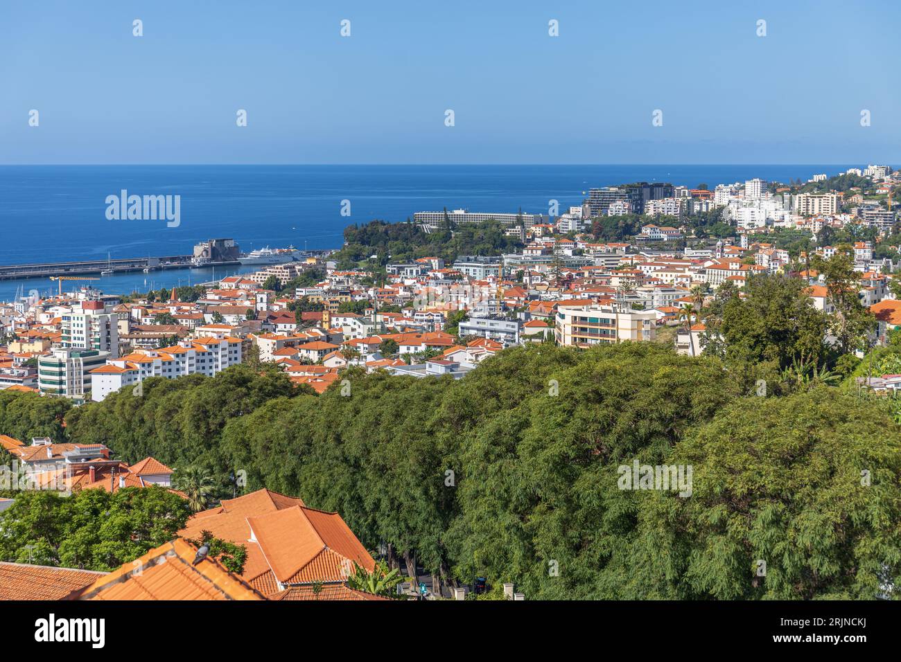 Aerial view of a small town in the valley surrounded by mountains with ...