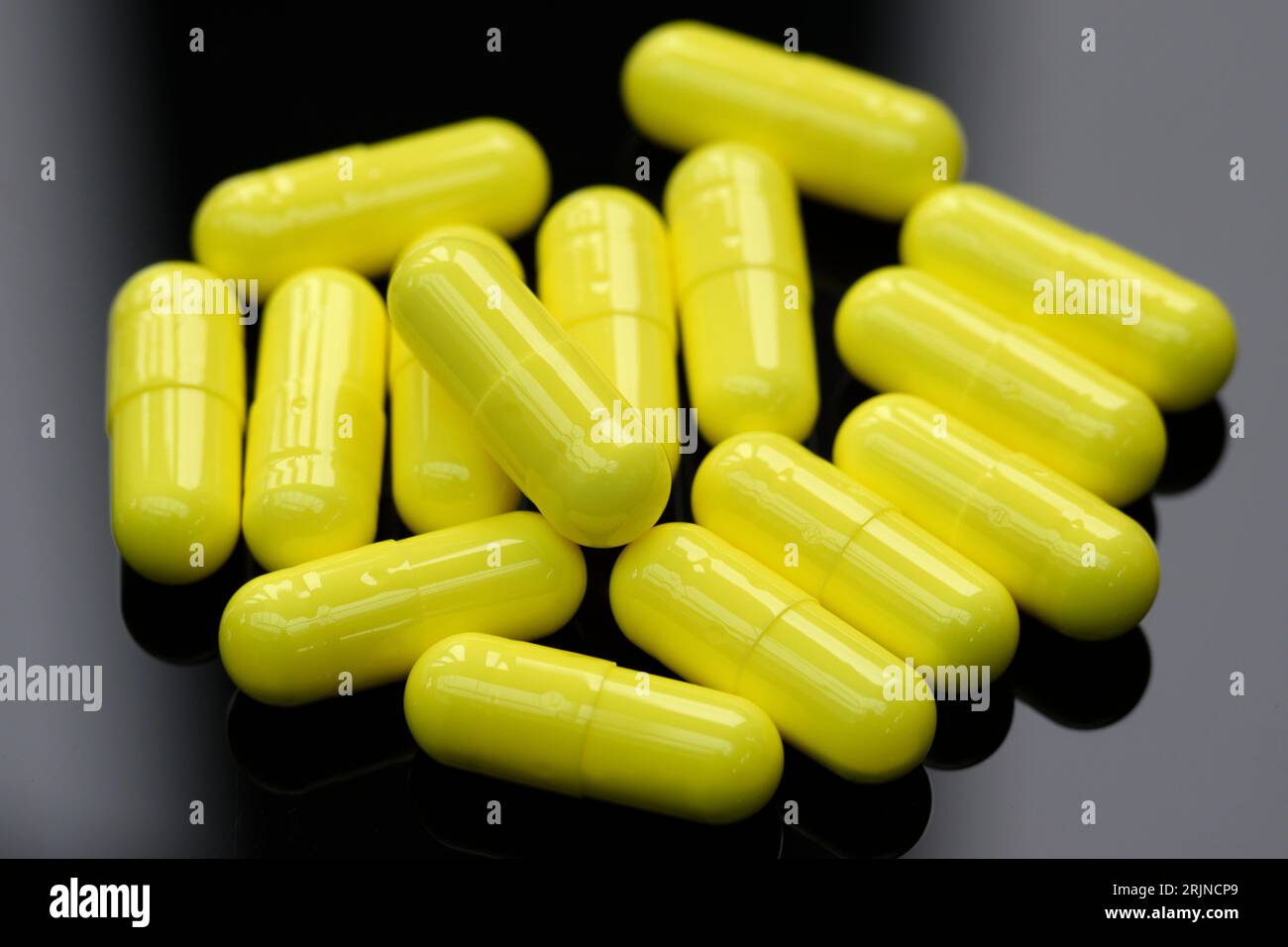 Yellow Medical capsules. Stock Photo