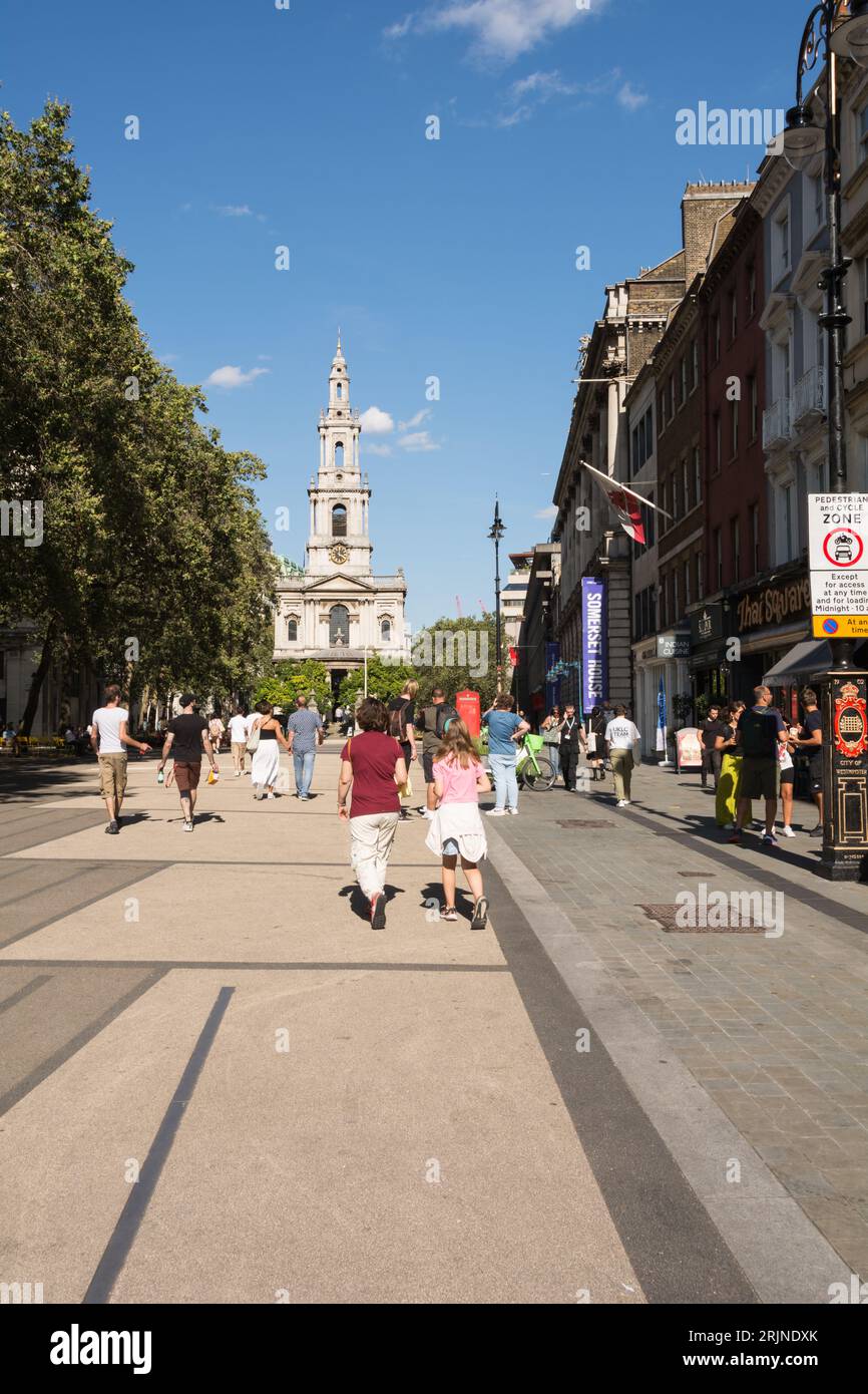 People enjoying the newly pedestrianised Strand and the adjoining Somerset House and St Clement Danes Church, Strand, London, England, UK Stock Photo