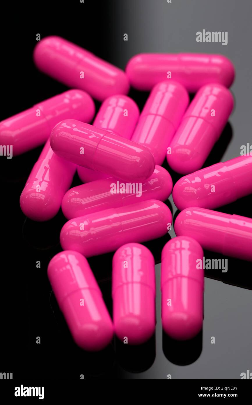 Pink Medical capsules. Stock Photo