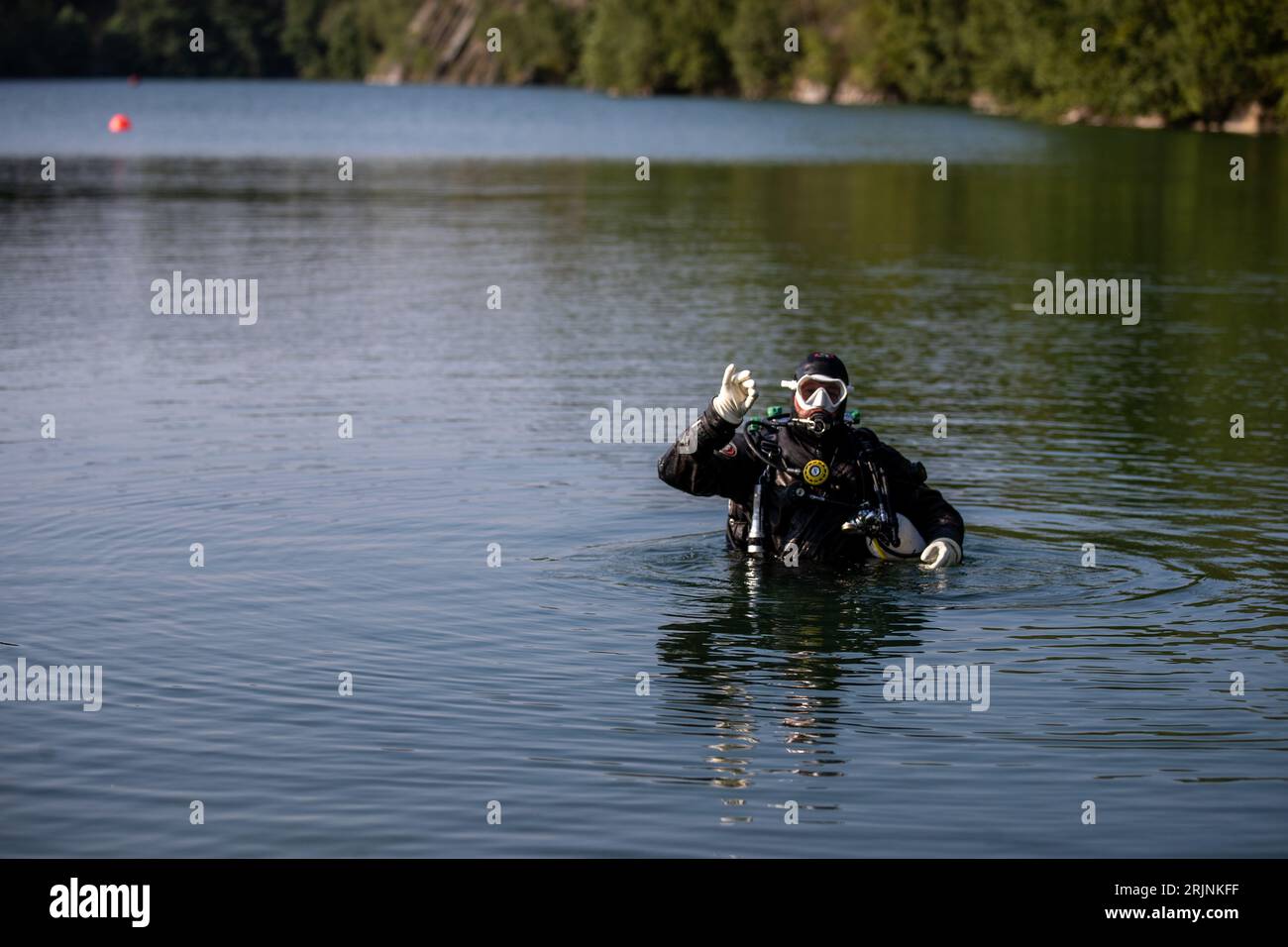 Svobodne Hermanice, Czech Republic. 23rd Aug, 2023. Fifteen divers dived successively in the flooded quarry Sifr in Svobodne Hermanice, Bruntal region, Czech Republic, August 23. 2023. After surfacing they all underwent a heart examination. Doctors are trying to find links in the results of the examinations of the individuals, who all undergo the same dive. They are trying to find out whether decompression events can be prevented in the future. Credit: Vladimir Prycek/CTK Photo/Alamy Live News Stock Photo