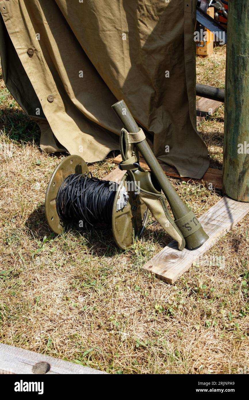 A military-grade machine mounted on a post in the ground Stock Photo