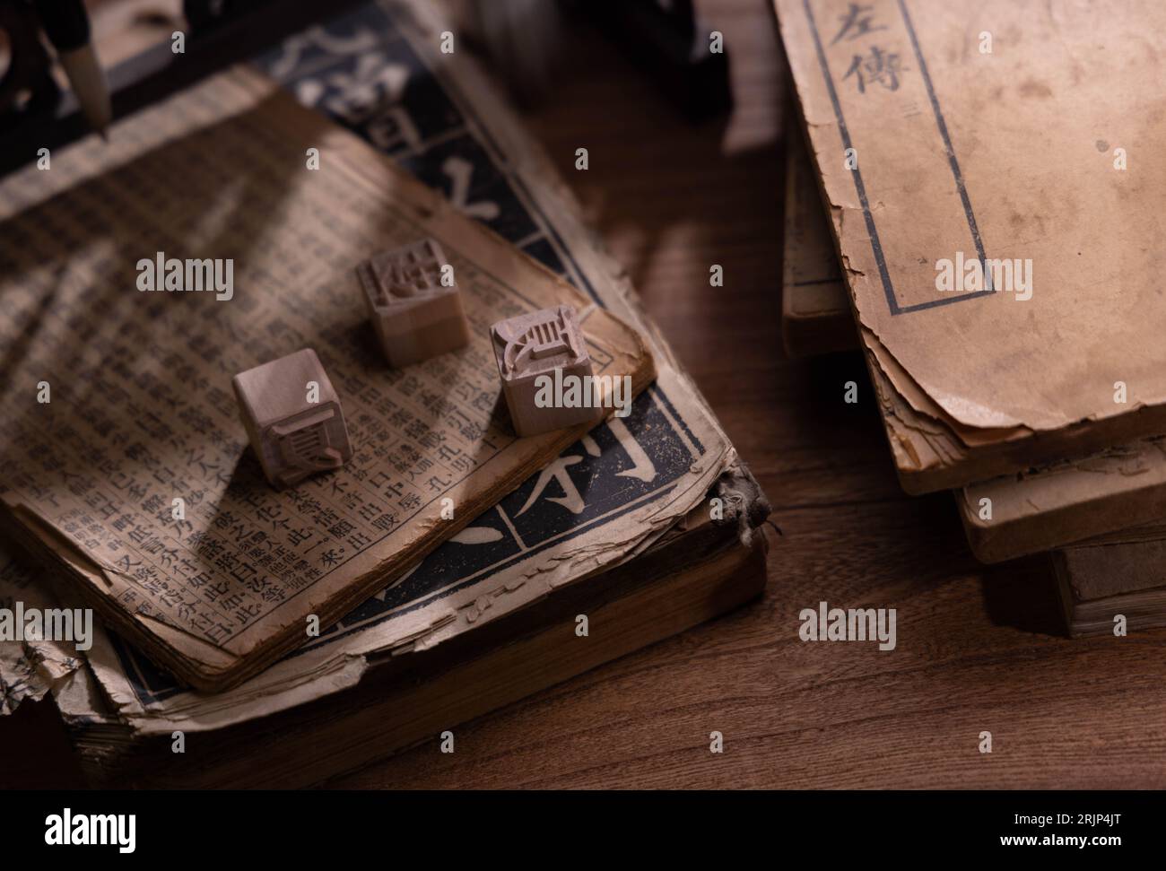 A closeup of ancient thread-bound books with Chinese characters, movable type printing. Stock Photo