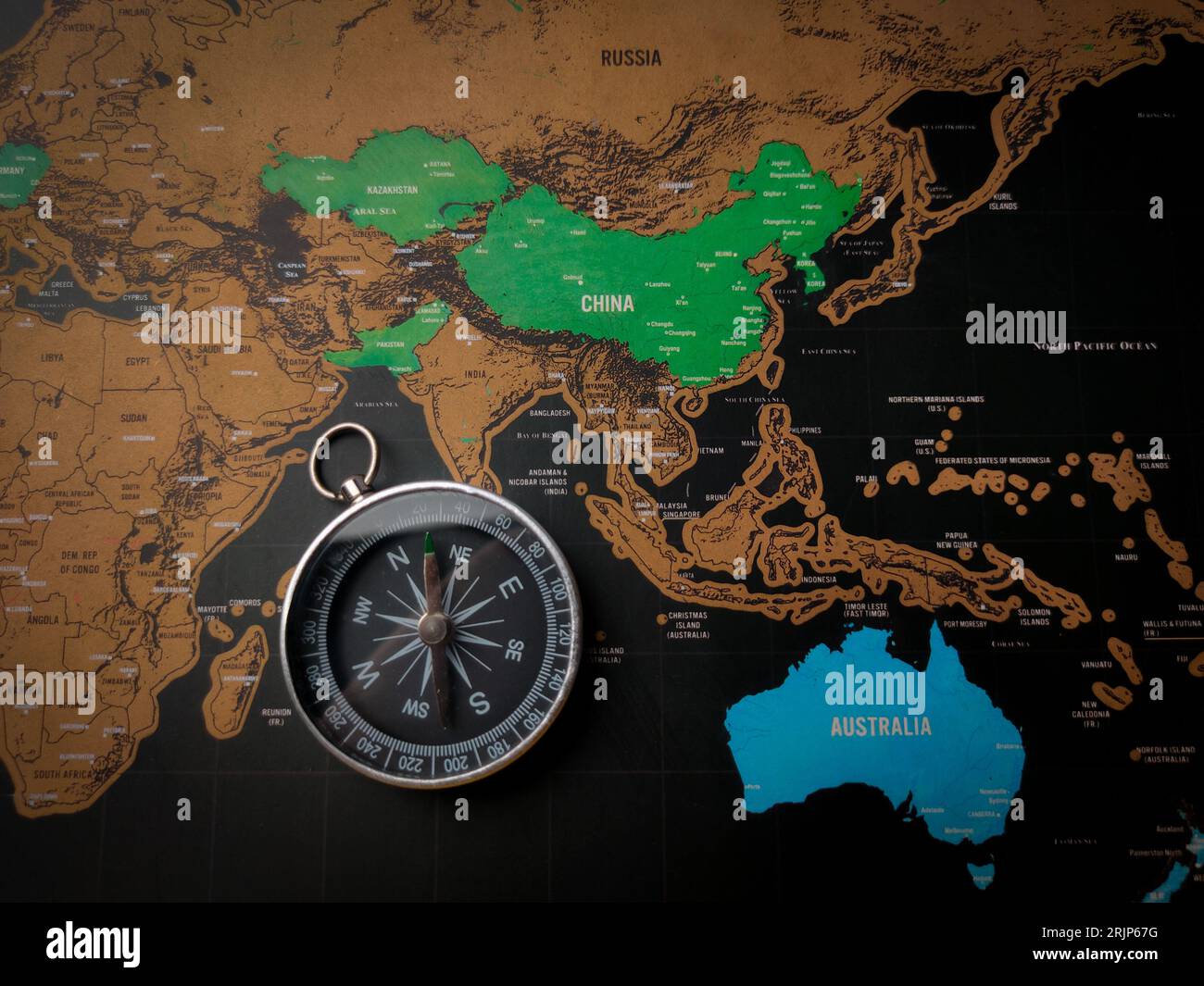 Top view world map and compass and focus to CHINA and AUSTRALIA map Stock Photo