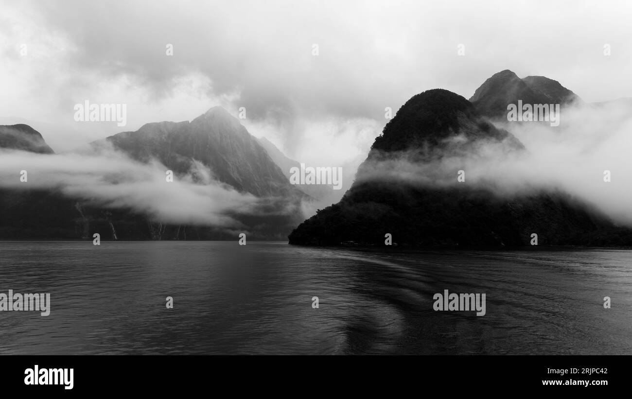 A breathtaking view of a majestic mountain range on an island shrouded