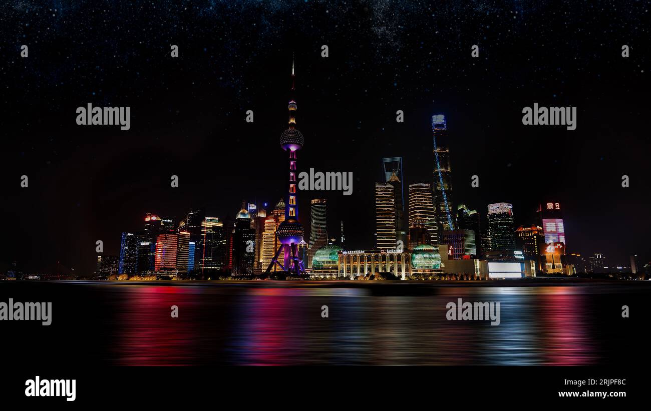 Aerial view of Shanghai at night, illuminated with the lights of the ...