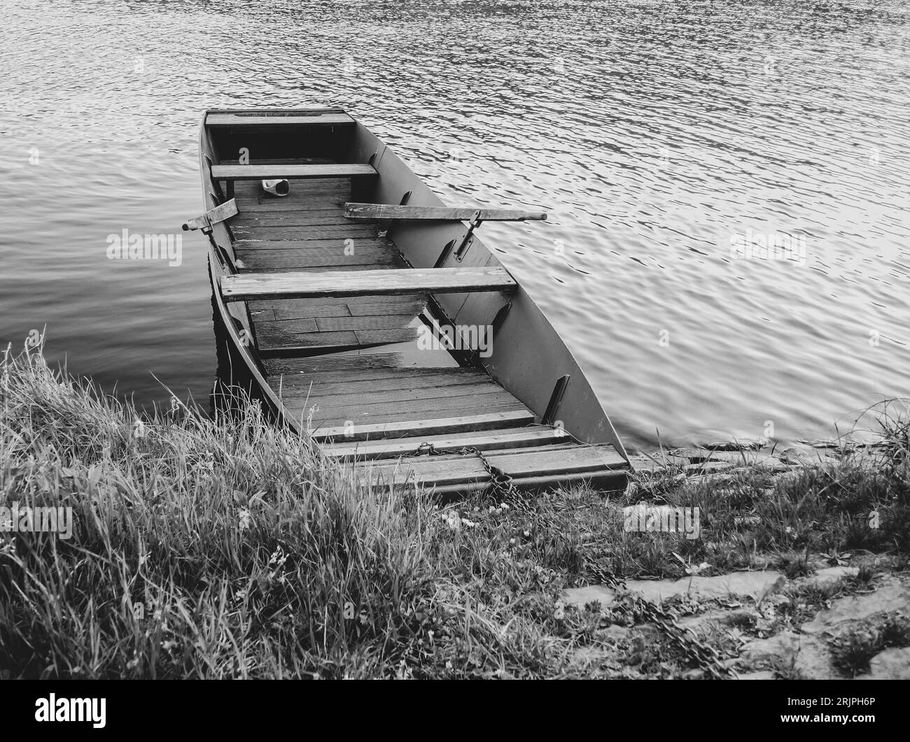 Moored boat by the shore, Black and White Stock Photo