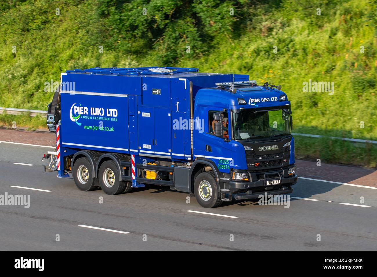 PIER (UK) Ltd, Plant and machinery, Long-term hire of suction excavators  in Newton-le-Willows, England travelling on the M6 motorway in Greater Manchester, UK Stock Photo