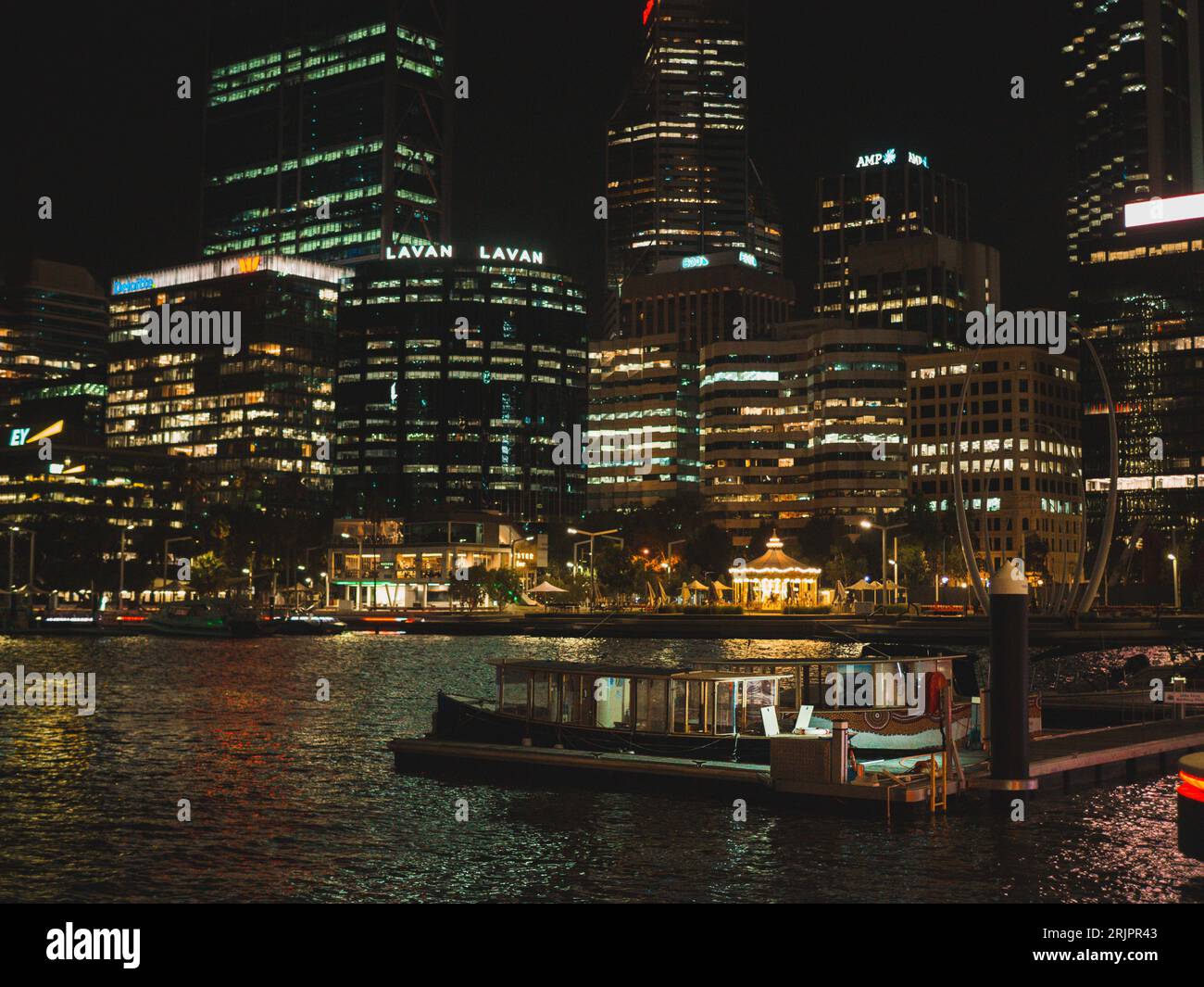 A night-time aerial view of a bustling cityscape, illuminated by the ...