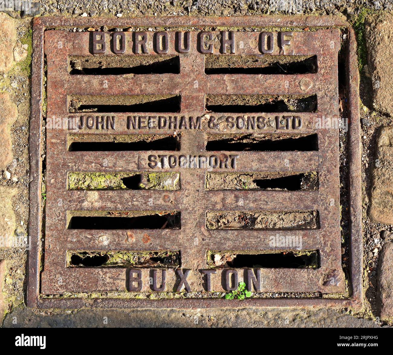 Borough of Buxton cast iron embossed grid, made by John Needham & sons ltd, Stockport, High Peak, Derbyshire, England, SK17 6XN Stock Photo