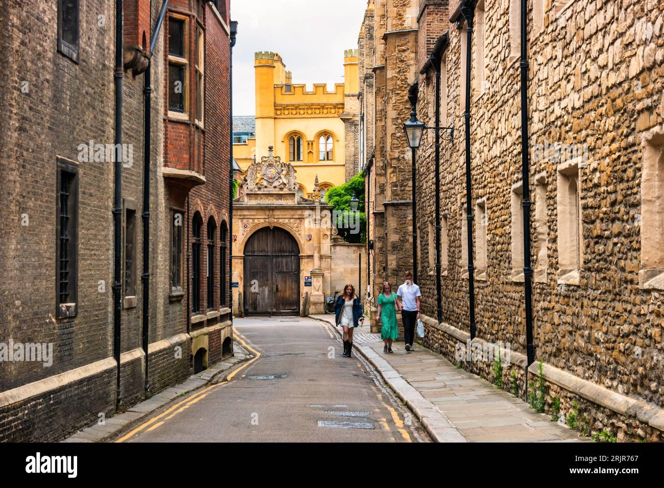 People walk on Trinity Lane, beside Trinity College in old town Cambridge, England, UK Stock Photo
