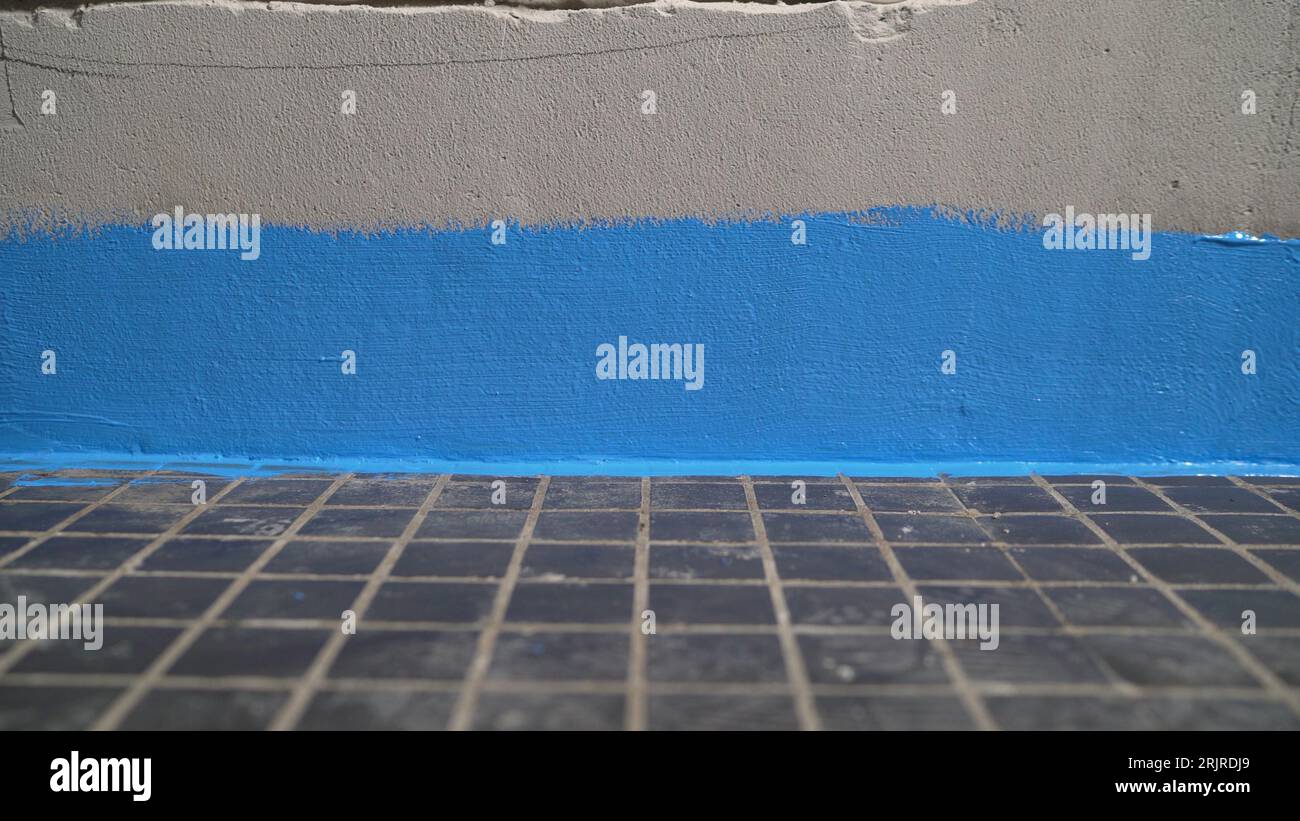Wall waterproofing. Bathroom renovation. Blue waterproofing in the