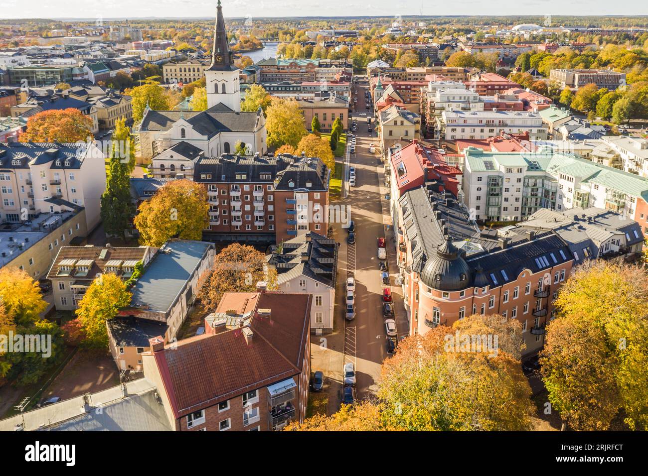 An Aerial View Of A Bustling Waterfront Cityscape With A Winding River An Aerial View Of A Bustling Waterfront Cityscape With A Winding River