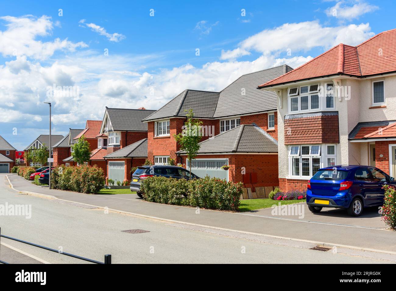 New houses along a street in a housing development on a sunny summer