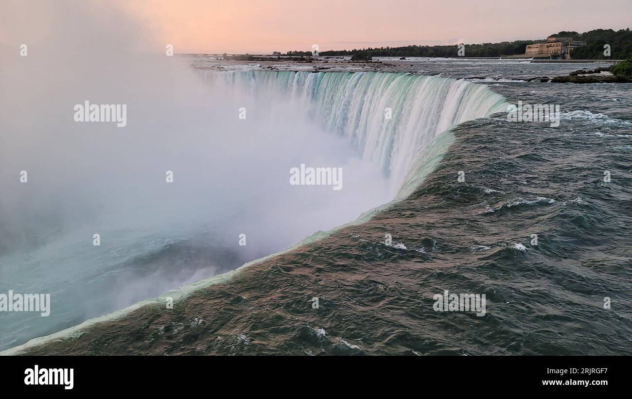 A scenic view of Niagara Falls in Canada at golden sunrise Stock Photo ...