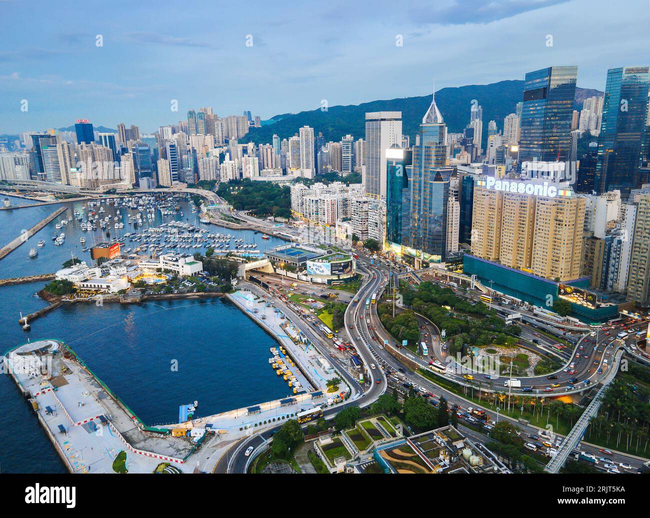 Hong Kong - August 10, 2023: Aerial skyline of Hong Kong island downtown modern cityscape. Urban jungle of the densely populated downtown at famous sp Stock Photo