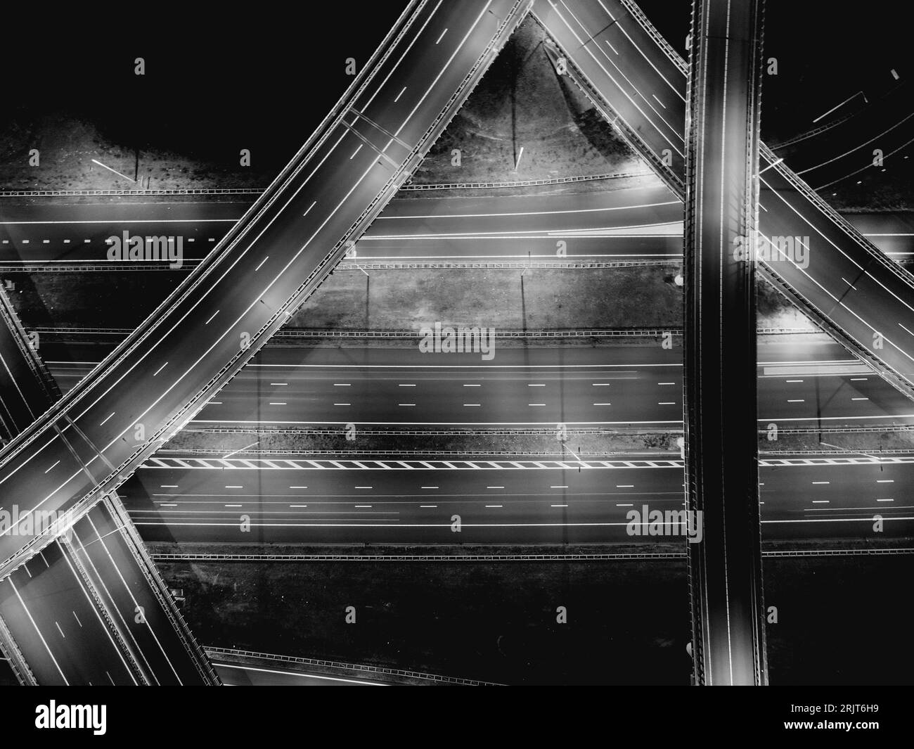 A nighttime scene of a bustling city street, illuminated by street