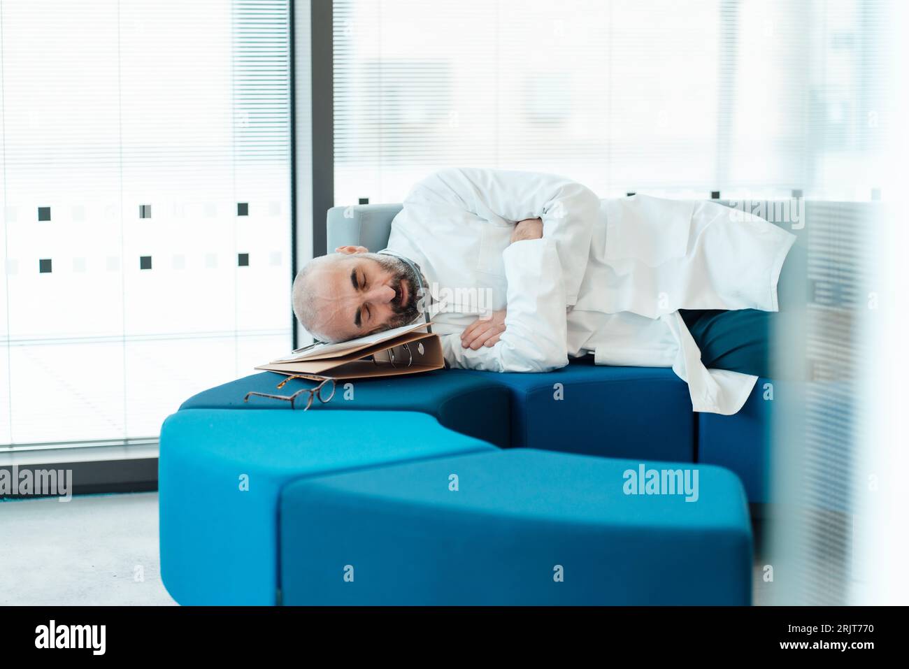 Tired doctor hi-res stock photography and images - Alamy