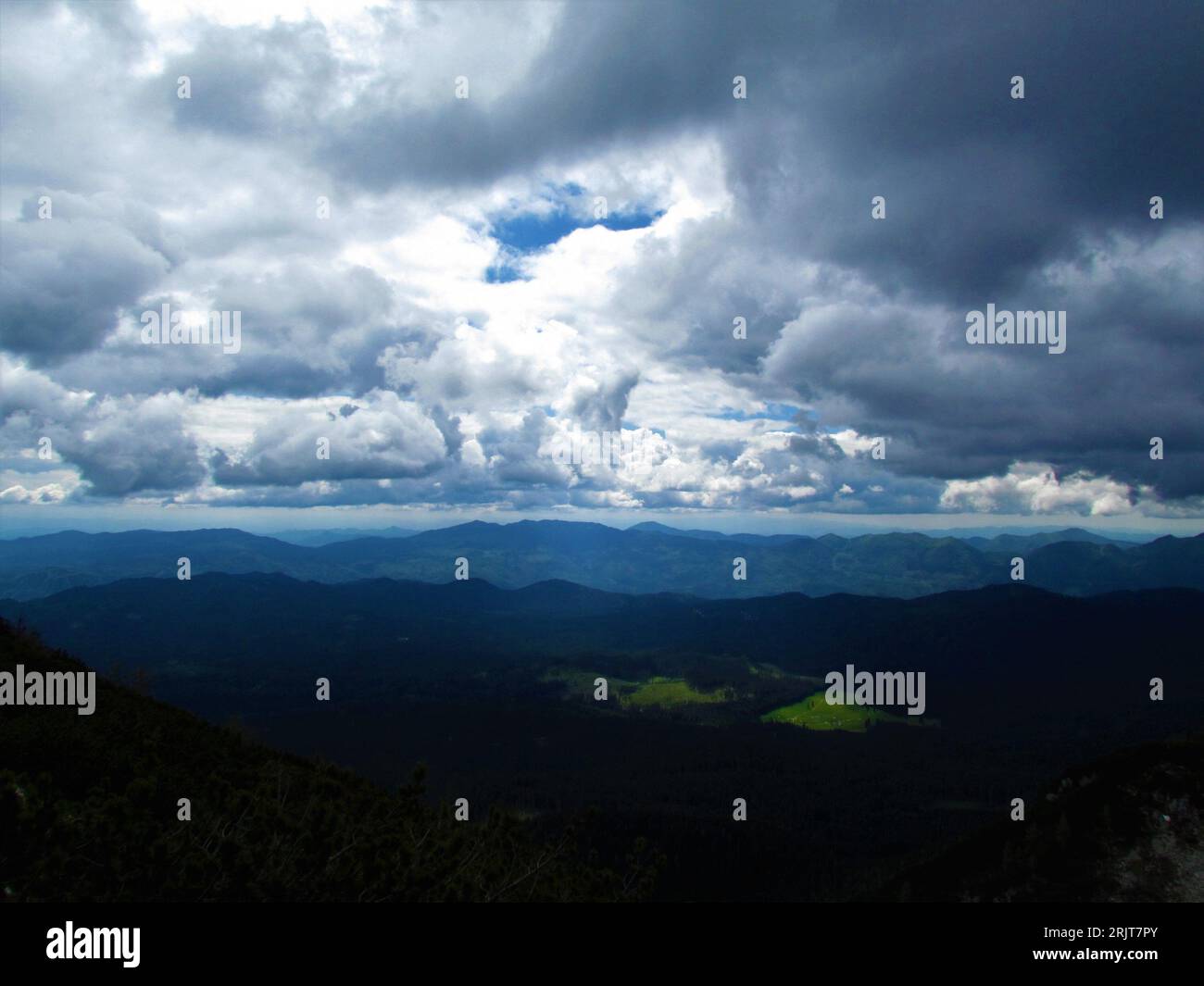 View of beautiful clouds above Pokljuka plateaou in Gorenjska region of Slovenia Stock Photo