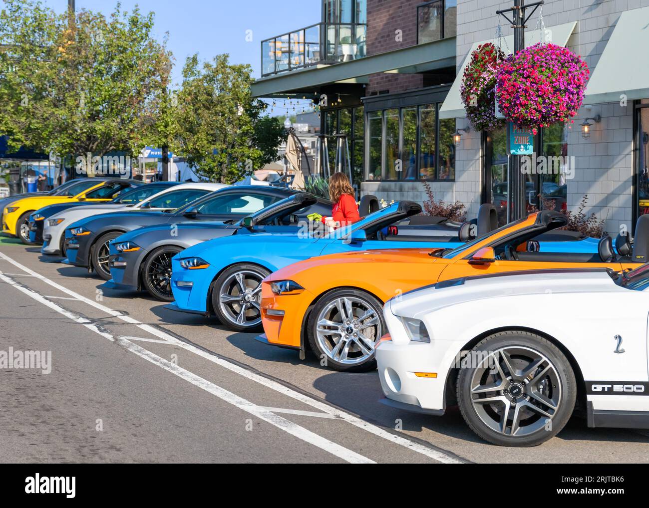 FERNDALE, MI/USA AUGUST 16, 2023 Driver polishing Ford Mustang car