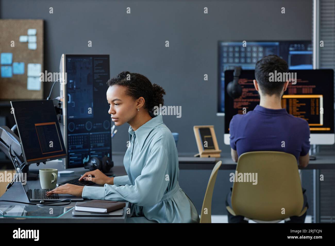 Young computer programmers coding on computer in office Stock Photo