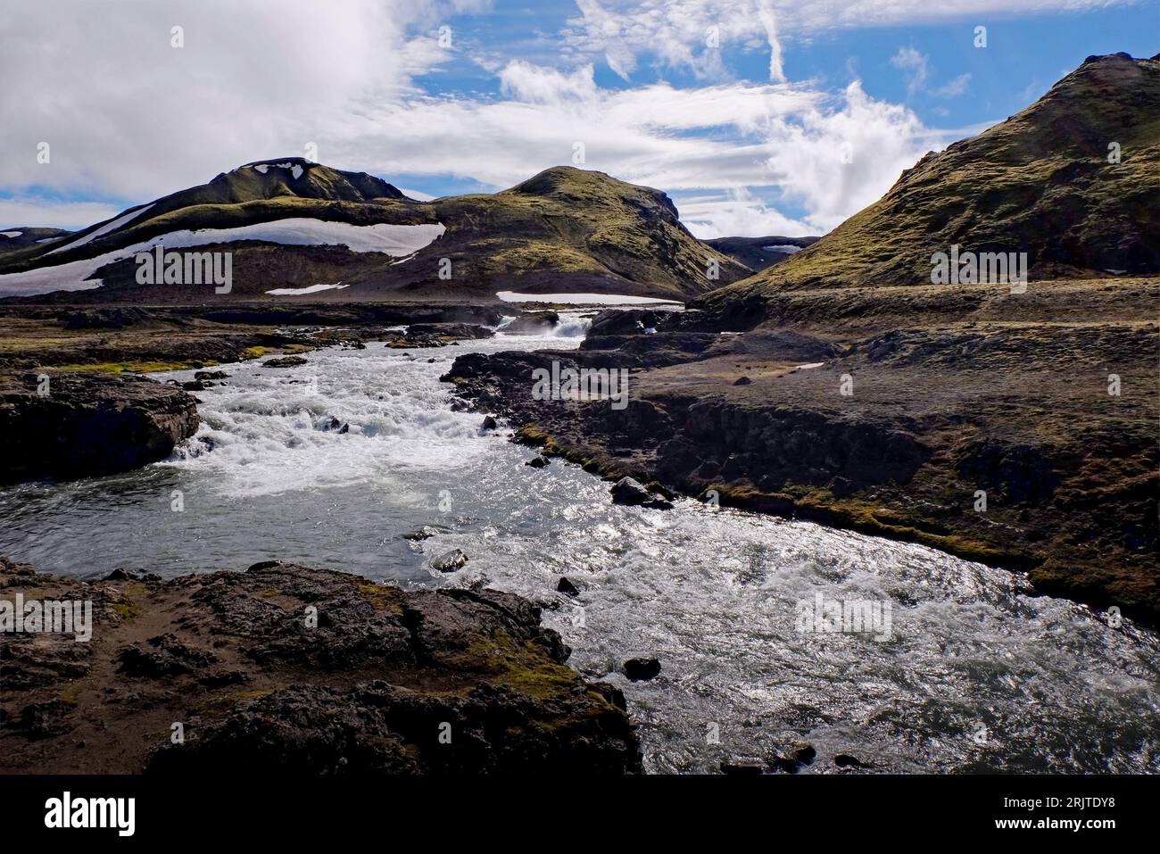 A picturesque landscape featuring a river winding its way through a ...