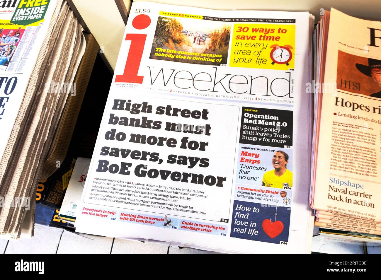 i weekend newspaper headline 'High street banks must do more for savers, says BoE Governor' front page financial article on newsstand UK 5 August 2023 Stock Photo