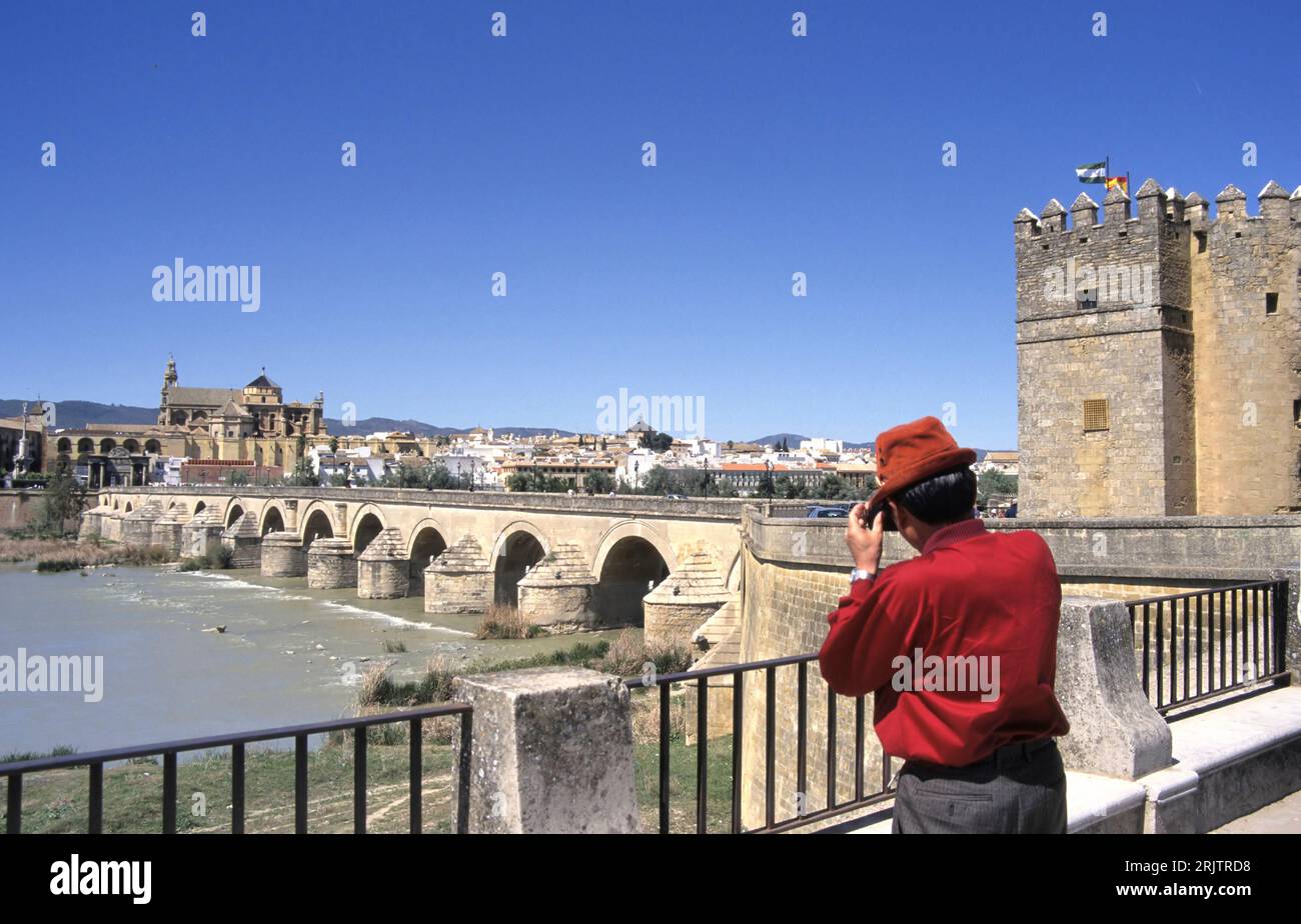 Roman Bridge on Guadalquivir river and The Great Mosque (Mezquita Cathedral) in the city of Cordoba, Andalusia. Stock Photo