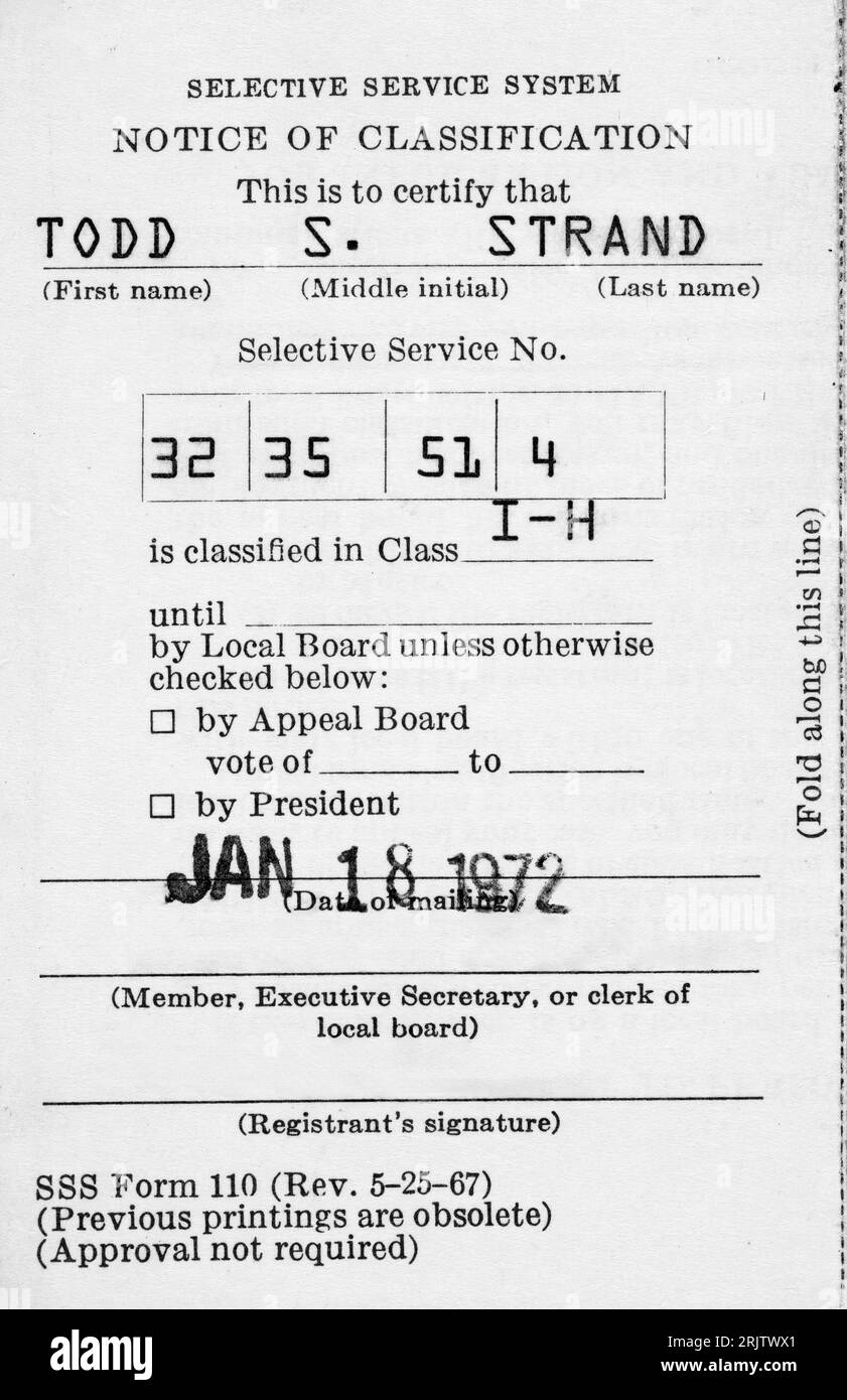A 1970s United States Selective Service System draft card from the Vietnam War era with a classification of I-H.  Within the cessation of registrant p Stock Photo