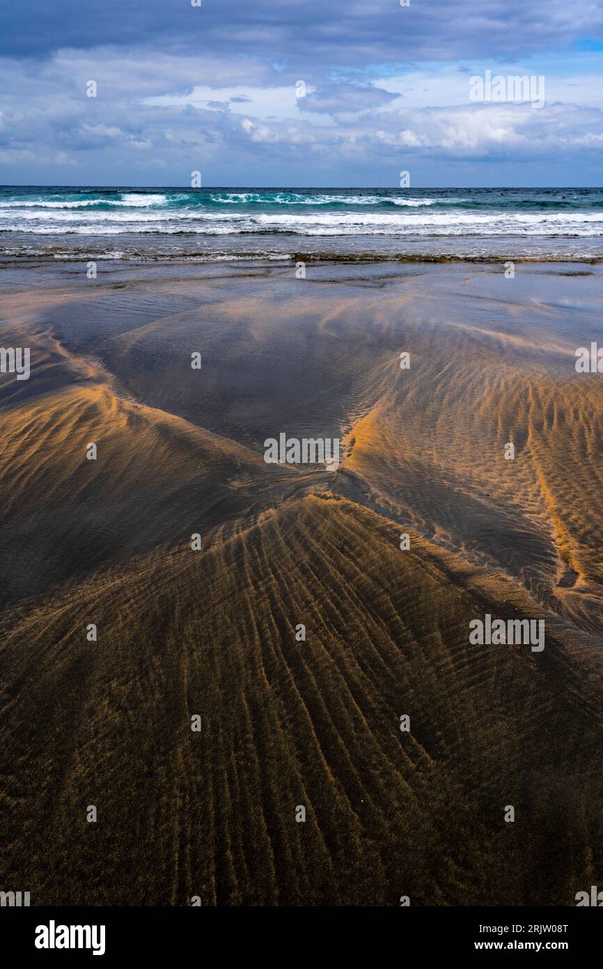 Black and gold sand on Playa de Otur, Asturias - Otur beach part of the Protected Landscape of the Western Coast of Asturias, Spain. Stock Photo