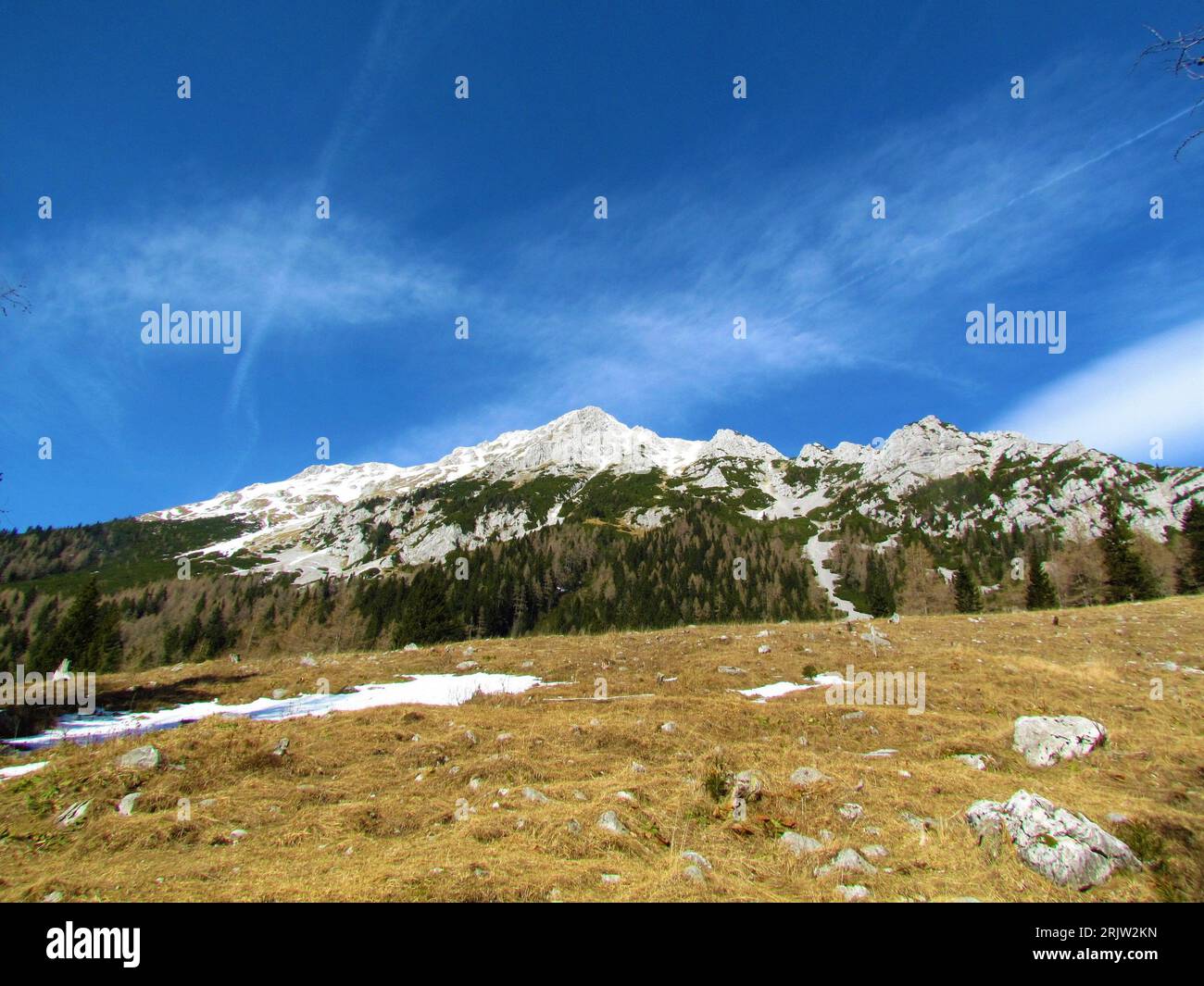 View of snow covered slopes under Vrtaca mountain in Karavanke ...