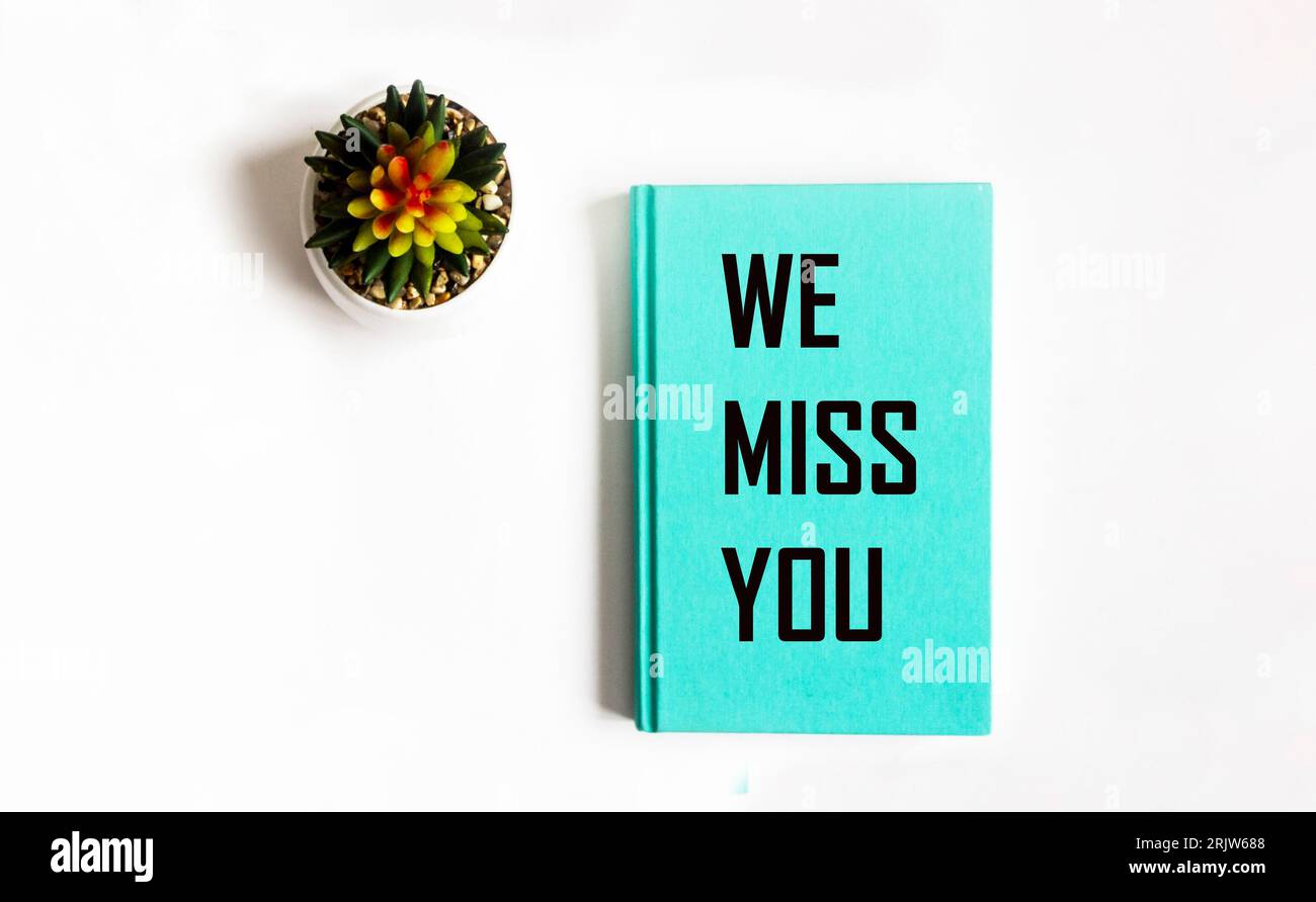 Tex We miss you on green notepad and white background Stock Photo