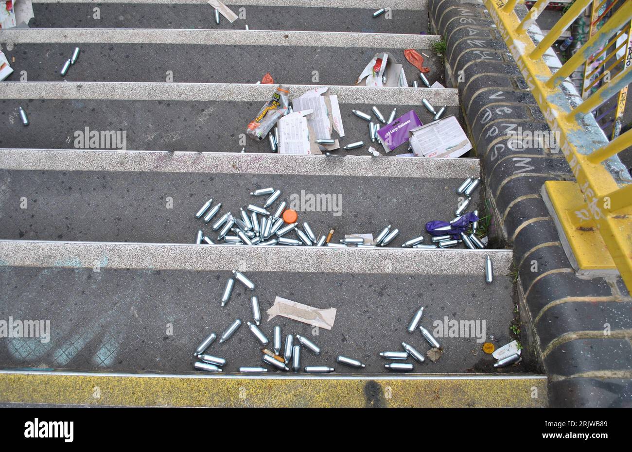 Used and discarded capsules of nitrous oxide lay on the steps of Fleet