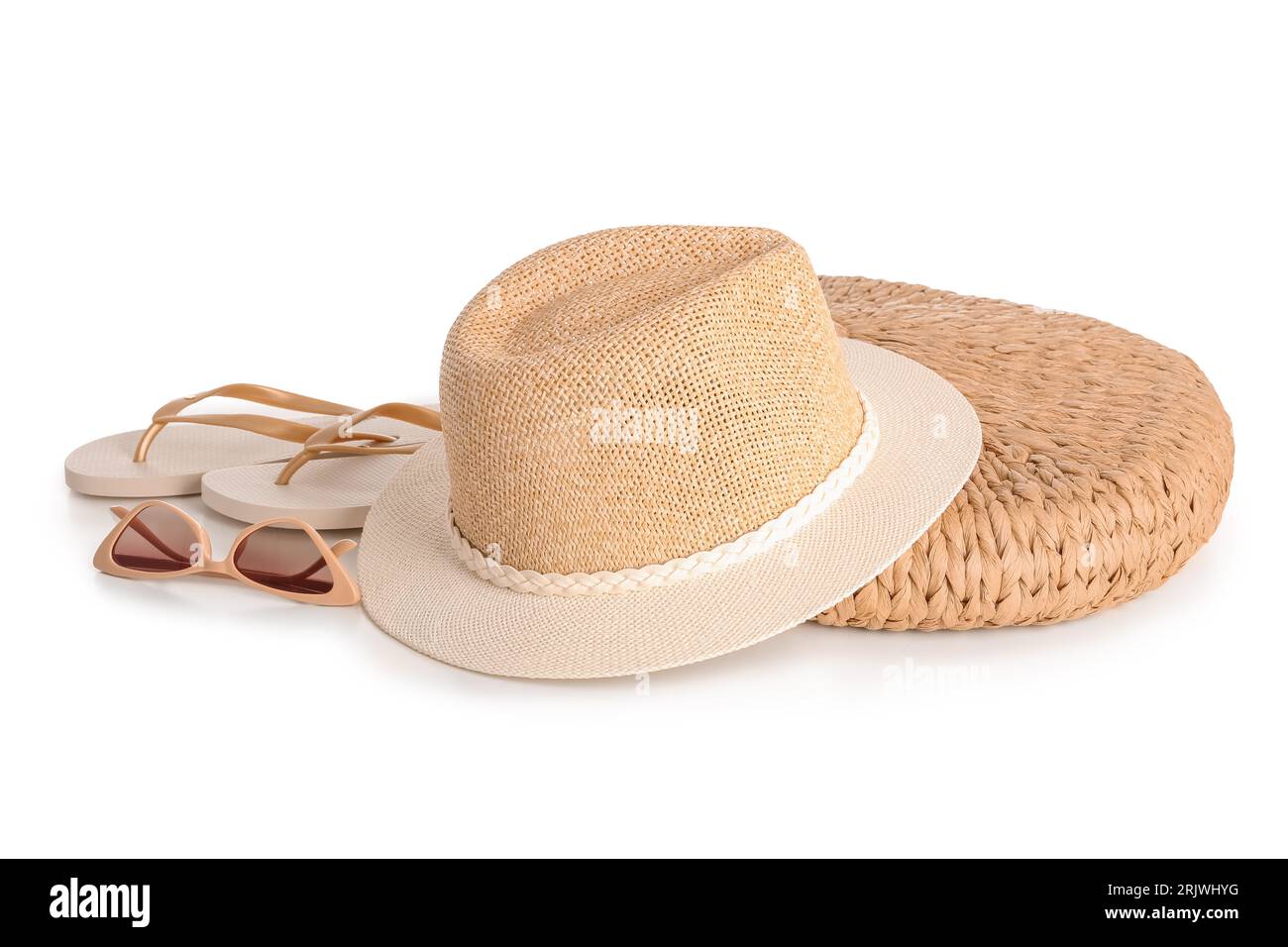 Stylish beach hat, flip flops, bag and sunglasses on white background ...