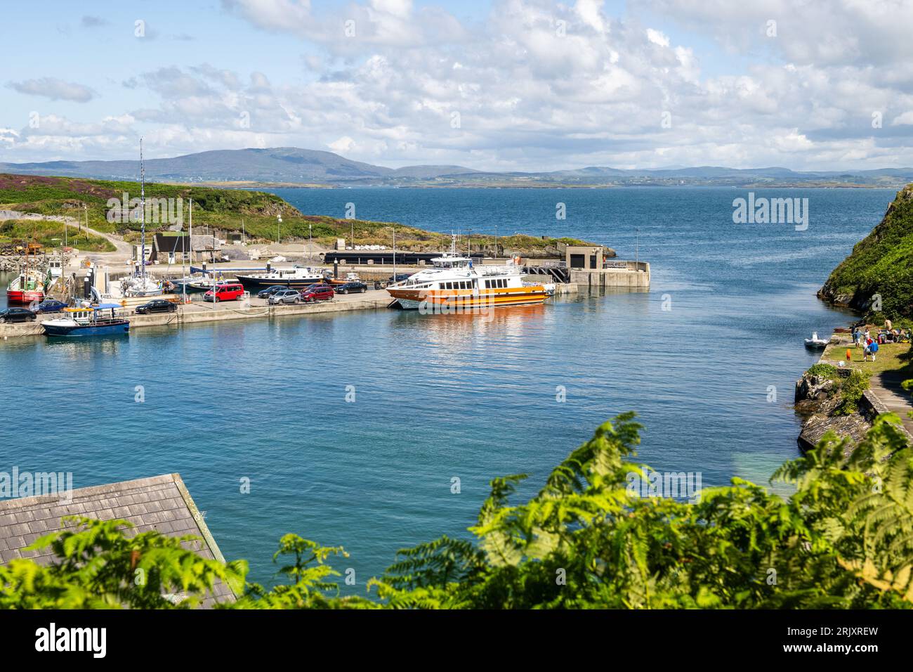 Cape Clear ferry 'Carraig Aonair' moored in the harbour of Cape Clear Island, West Cork, Ireland. Stock Photo